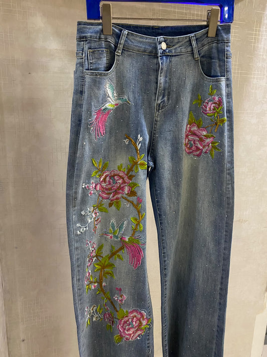 Beautiful wide-leg denim jeans accented with vibrant pink floral embroidery and subtle sparkling embellishments FT950