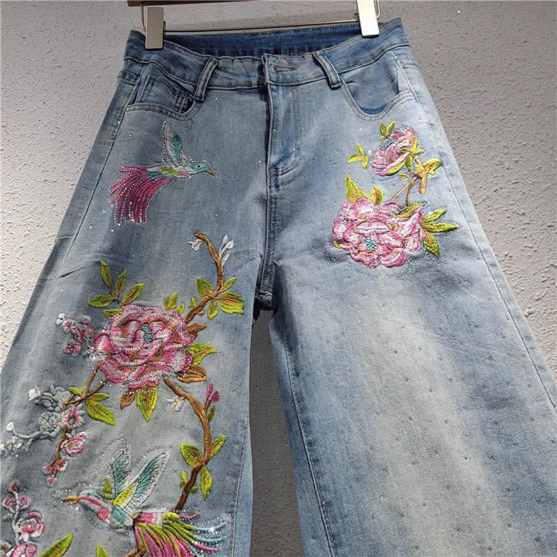 Beautiful wide-leg denim jeans accented with vibrant pink floral embroidery and subtle sparkling embellishments FT950