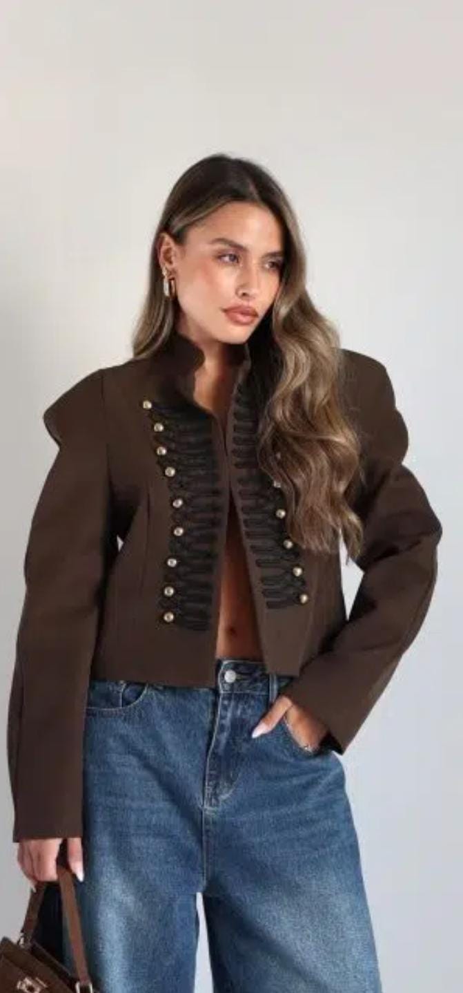 Elegant  off-white two-piece set with a military-inspired cropped jacket accented by black braiding and metallic buttons FT954